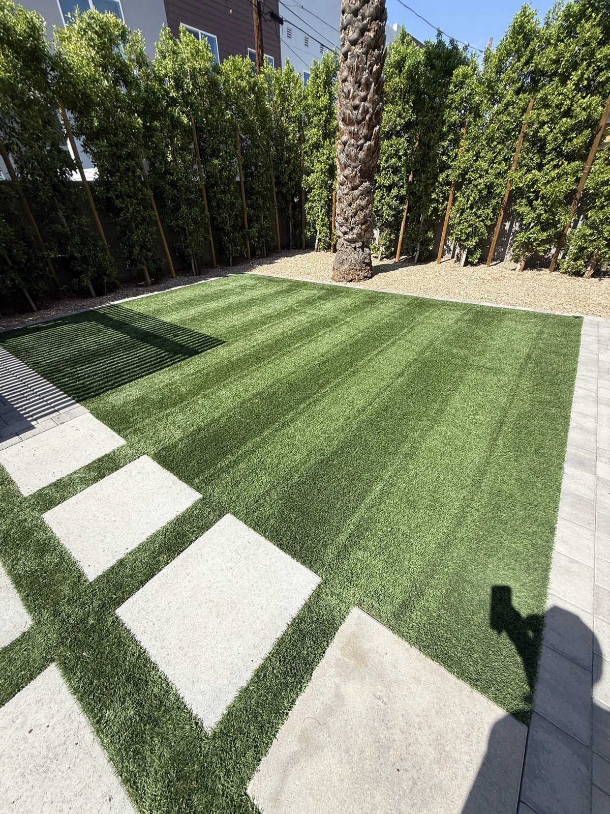 Freshly cleaned and brushed artificial turf lawn