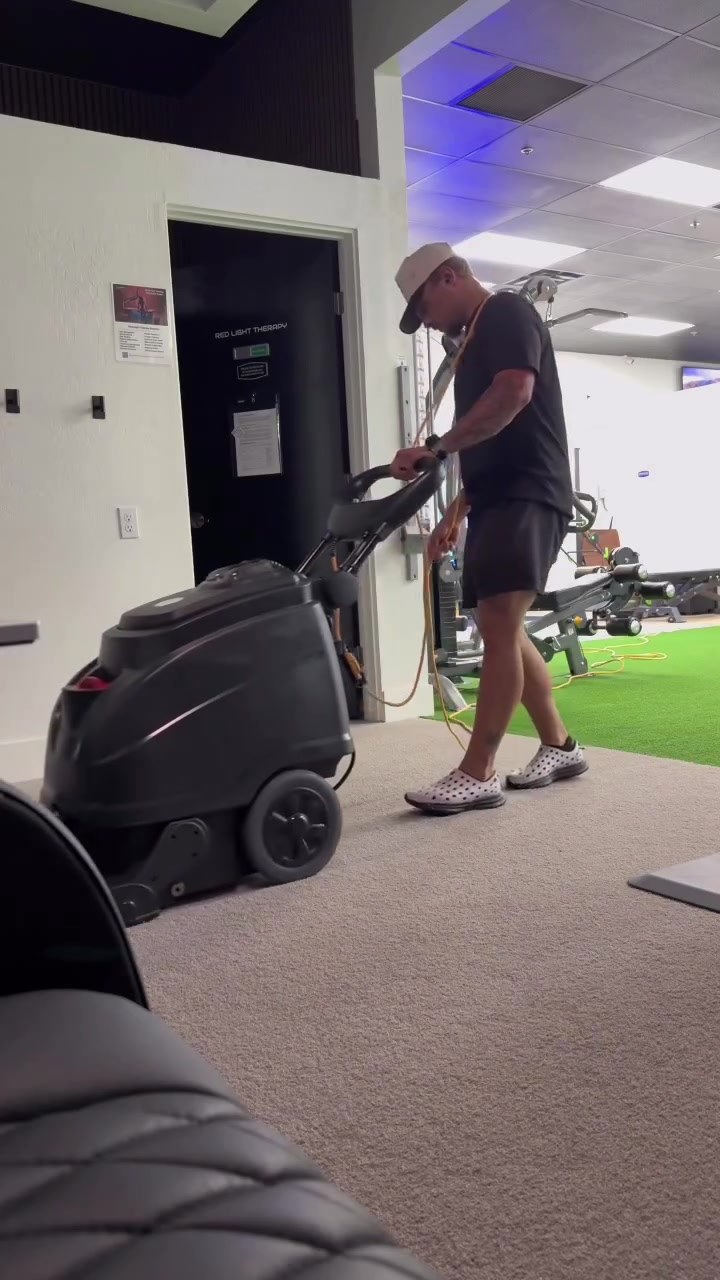 Bringing a commercial extraction machine onto indoor gym turf in Queen Creek, AZ - Turf Tune Up