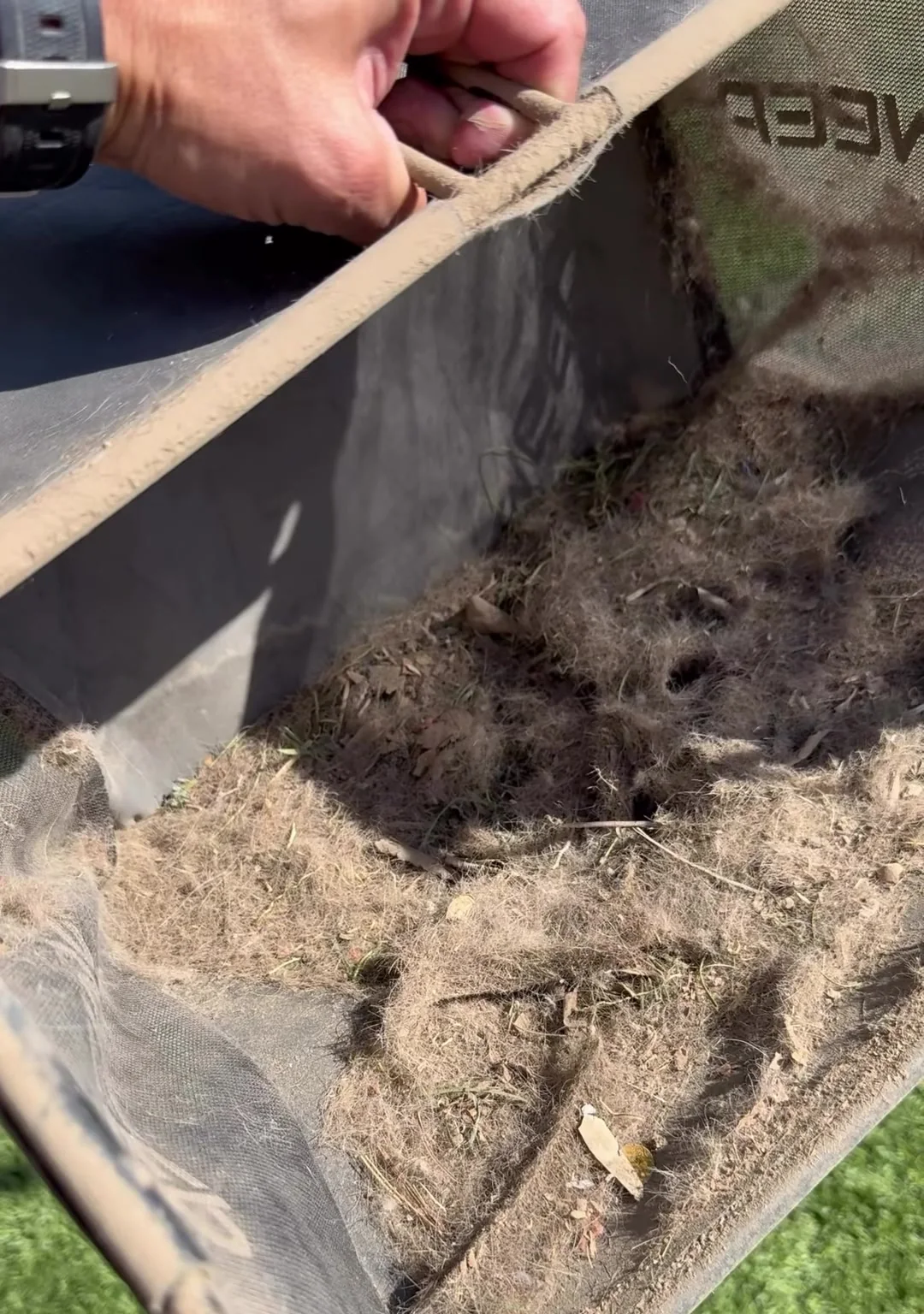 Debris uncovered beneath artificial turf during a cleaning